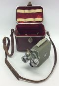 A cased Eumig movie camera. Est. £25 - £35.