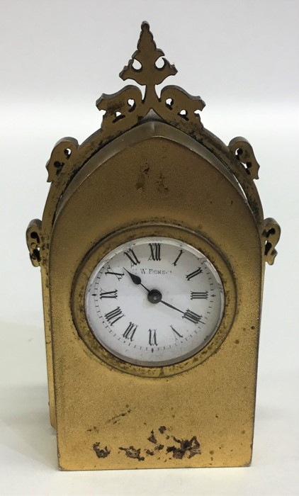A small brass mounted Gothic style carriage clock.