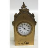 A small brass mounted Gothic style carriage clock.