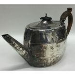 A Georgian oval bright cut silver teapot with flus