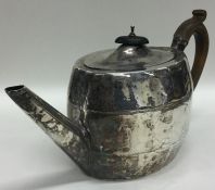 A Georgian oval bright cut silver teapot with flus
