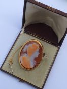 A large boxed hard stone cameo of a lady in gold f