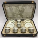 An attractive cased Wedgwood coffee set with silve