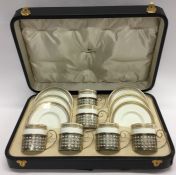 An attractive cased Wedgwood coffee set with silve