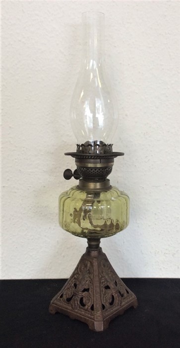 An oil lamp decorated with cast base.