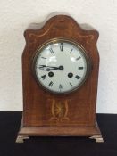 An Edwardian mahogany mantle clock inlaid with de