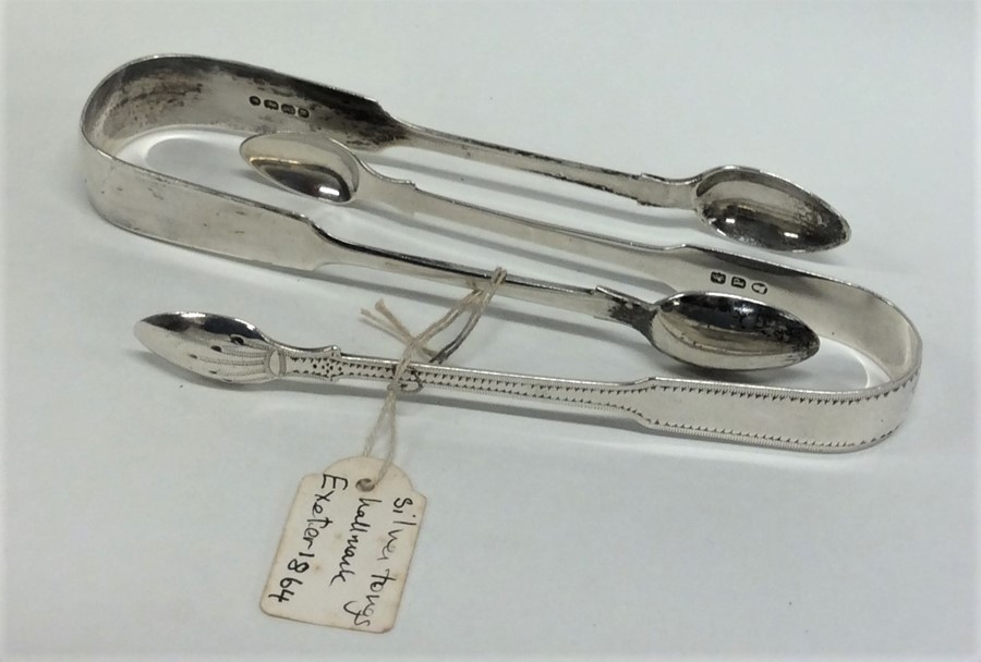 Two pairs of silver sugar tongs. Various Exeter ma