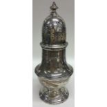 A heavy tall silver caster with lift-off cover. Lo