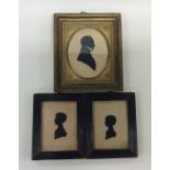 A group of three small framed silhouettes. Est. £1