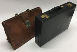 An old Harrods leather briefcase together with one other.