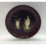 A 19th Century Japanese lacquered dish decorated w