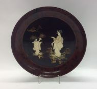 A 19th Century Japanese lacquered dish decorated w