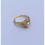 An 18 carat gold pearl and diamond French ring dec
