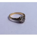 An attractive diamond single stone ring decorated