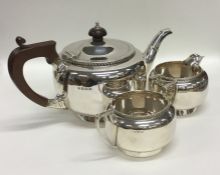 A plain silver circular tea service with gadroon r