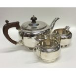 A plain silver circular tea service with gadroon r