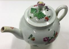 An early Worcester teapot and cover decorated with
