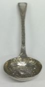A Georgian silver sifter ladle with gilt bowl. Lon