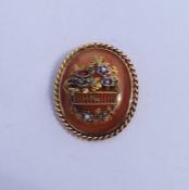 A good quality oval hard stone brooch decorated wi