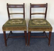 A pair of Georgian mahogany hoop back chairs. Est.