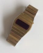 A stylish gilt metal digital wristwatch on expandi