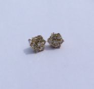 A good pair of diamond cluster earrings in 18 cara