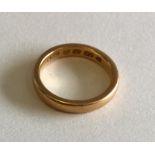 A heavy 22 carat gold wedding band. Approx. 5 gram