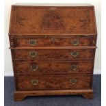 A burr walnut Georgian style four drawer bureau. E