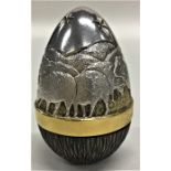STUART DEVLIN: A silver and silver gilt egg of typ