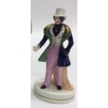 A Staffordshire figure of a gentleman with blue ja