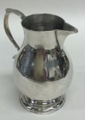 An early Georgian silver sparrow beak cream jug of