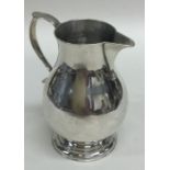 An early Georgian silver sparrow beak cream jug of