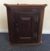 A small Georgian corner cupboard with panelled doo