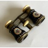 A pair of enamel decorated opera glasses with flor