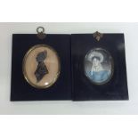 A framed oval miniature of a lady together with a