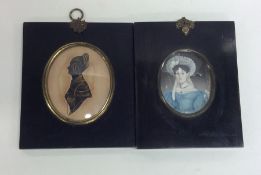 A framed oval miniature of a lady together with a