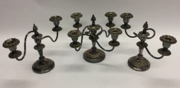 A pair of silver plated candelabra together with a