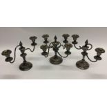 A pair of silver plated candelabra together with a