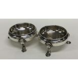 A pair of Georgian circular silver salts on reeded