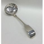 EXETER: A silver fiddle pattern sifter spoon. By J
