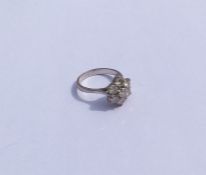 A good diamond daisy head cluster ring in platinum