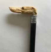 A good carved walking stick in the form of a greyh