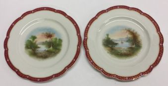 A pair of English hand painted cabinet plates with