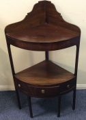 A Georgian mahogany corner wash stand on square su