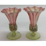 A pair of attractive cranberry glass vases on moul