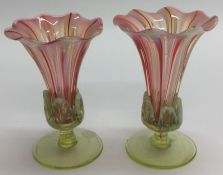 A pair of attractive cranberry glass vases on moul