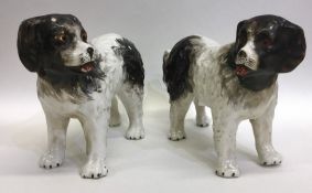 A pair of early Staffordshire dogs with textured b
