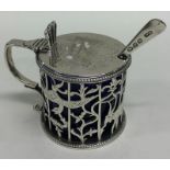 A large Georgian silver mustard decorated with flo