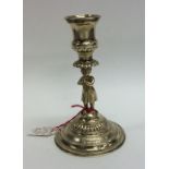 A Continental silver gilt tapering candlestick wit