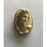 A large oval ivory cameo of a lady in high relief.